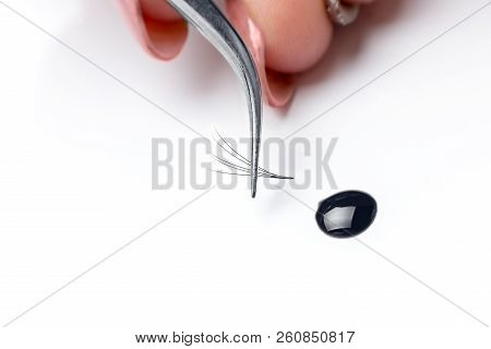 Closeup Eyelash Extension Tweezers Tools On White Background. Artificial Lashes 5d.