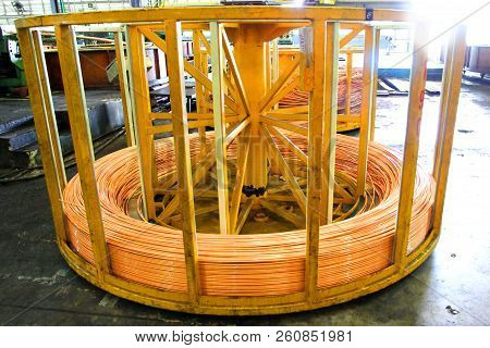 Rolls Of Copper Tube Are Rolling In Basket To Be Sent Out To Customers.