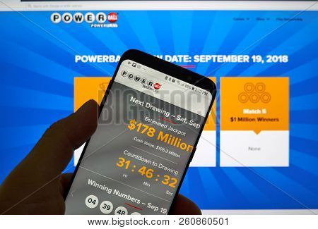 Montreal, Canada - September 23, 2018: Powerball Page On A Cellphone Screen Over A Laptop Screen. Po