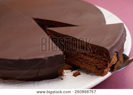 Chocolate cake slice on a cake server