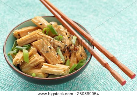 Chinese and Korean yuba salad with green onion and sesame seeds