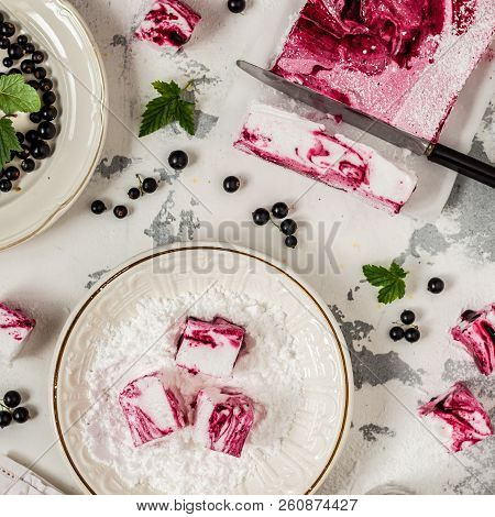 Blackcurrant Swirl Marshmallow In A Plate With Icing Sugar, Square
