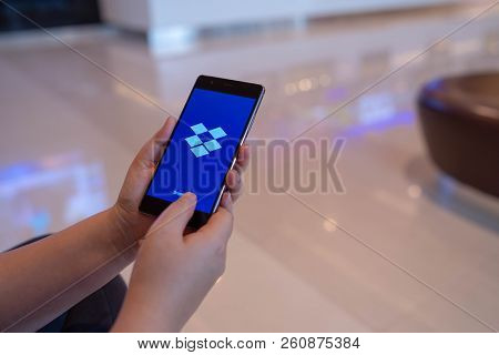 Chiang Mai, Thailand - August 03,2018: Woman Holding Huawei With Dropbox On Screen. Dropbox Is A Ser
