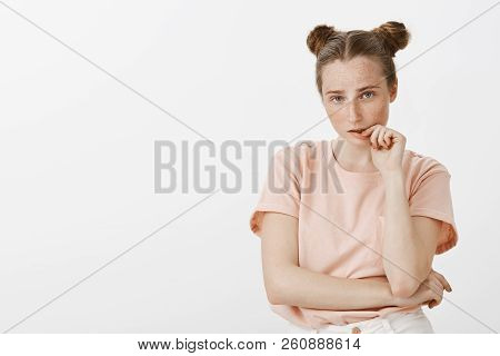 Portrait Of Tired And Smart Good-looking Fashionable Girlfriend With Cute Buns Hairstyle And Freckle