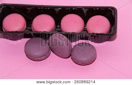 Macaroni On A Gently Pink Background. Delicious Cakes For Tea. Dessert Close-up.