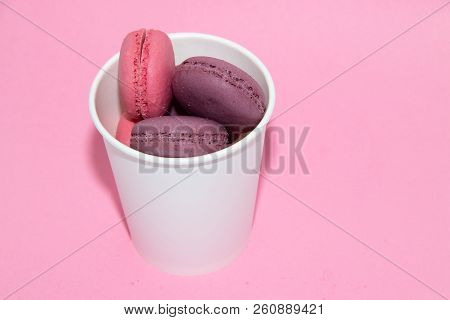 Macaroni On A Gently Pink Background. Delicious Cakes For Tea. Dessert Close-up.