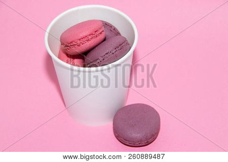 Macaroni On A Gently Pink Background. Delicious Cakes For Tea. Dessert Close-up.