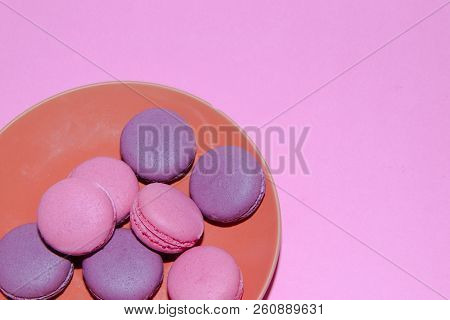 Macaroni On A Gently Pink Background. Delicious Cakes For Tea. Dessert Close-up.