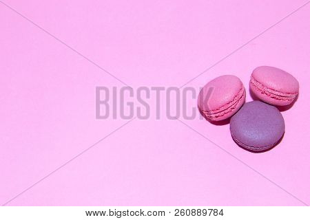 Macaroni On A Gently Pink Background. Delicious Cakes For Tea. Dessert Close-up.