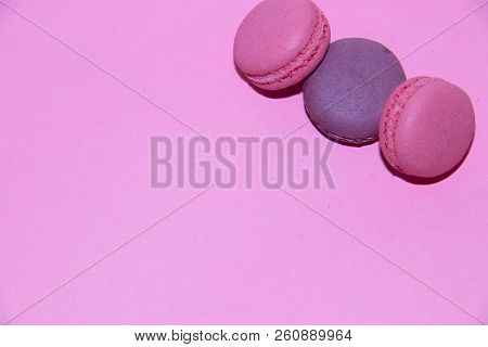 Macaroni On A Gently Pink Background. Delicious Cakes For Tea. Dessert Close-up.