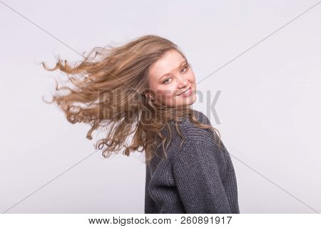 Portrait Of Beautiful Young European Blonde Woman With Blond Flatterig Hair.
