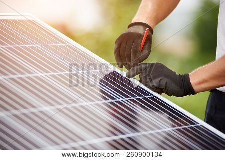 Close-up Technicians Hands In Protective Gloves Making Mark With Pencil On Metal Platform For Instal