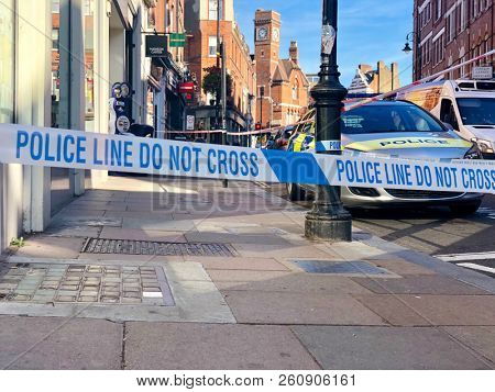 HAMPSTEAD, LONDON - SEPTEMBER 26, 2018: A Police cordon Line surrounds the scene of a crime in Hampstead, North London, UK.