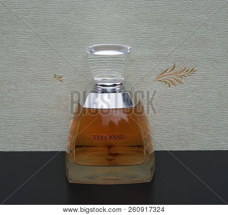 Vera Wang, Fragrance For Ladies, Large Perfume Bottle In Front Of The Satin Wallcovering Elysee