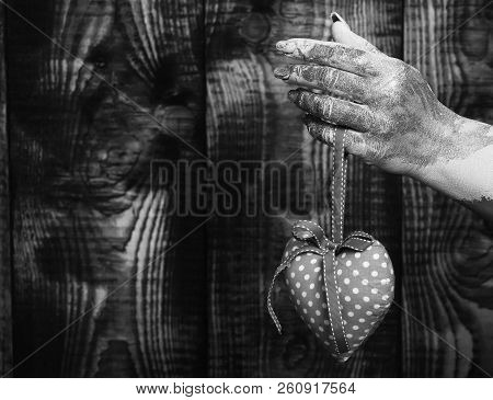 Female Hand Smeared In Golden Paint Or Glister Holding Handmade Pink Polka Dots Selective Focus Vale