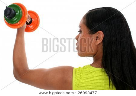 Beautiful woman in sports outfit working biceps with colorful dumbells.