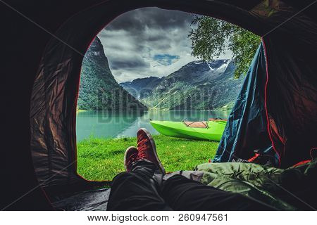 Scenic Tent Spot In The Norway. Glacial Lake And The Mountains. Norwegian Landscape. Waterfront Camp