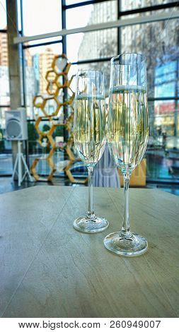 Two Wedding Glasses With Champagne On The Table