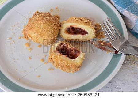 Plum Dumplings Knedle On The White Plate On The Wooden Table