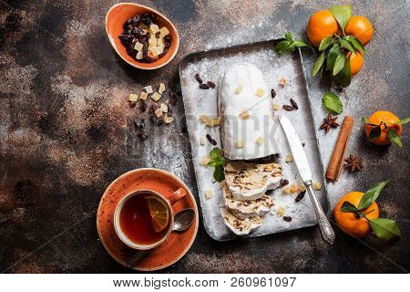 Christmas Stollen, Traditional German, European Festive Dessert Cut Into Pieces On Dark Background. 