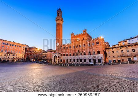 Siena, Italy. Palazzo Publico And Piazza Del Campo At Twilight.