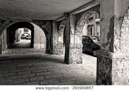 Chioggia, Italy-august 26, 2018: Province Of Venice. Street With An Arch And Columns.