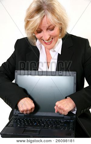 Attractive 40 something woman upset with her laptop.