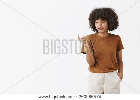 You Kall It Size. Unimpressed Careless And Indifferent Cute African American Female Student With Afr