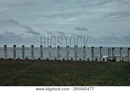 Lankaran, Azerbaijan - Apr 18 2011: Caspian Sea Shore With Concrete Piles And Some Submerged Structu