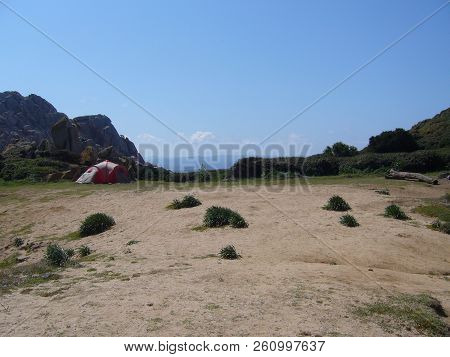 Nylon Tent Erected For Camping Vacation In Isolated Meadow, Sardinia, Italy