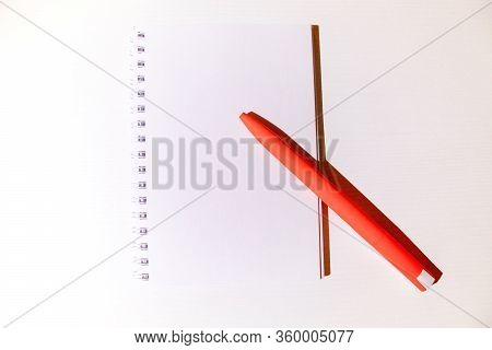 Top View Of Notebok With Pencil On Wooden Table. Emtry Page For Text.