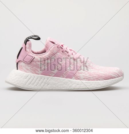 Vienna, Austria - August 14, 2017: Adidas Nmd R2 Pink And White Sneaker On White Background.
