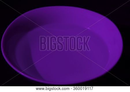 White Bowl Filled With Water On Black Background