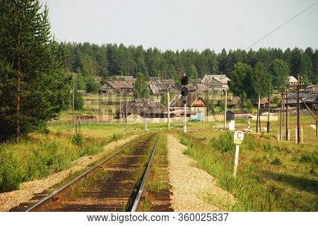 Old Russian Railway Line And Station With Half-grown Tracks