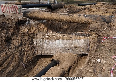repair and replacement main pipeline of heating systems, district heating pipes network, water supply or Sewerage in city, removing old pipes and replacing them with new ones in a hole in the ground