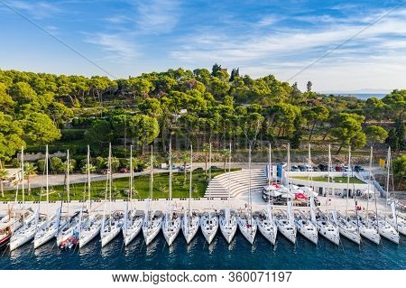 Croatia, Maslinica, 15 September 2019: Drone View Point On Moored In An Equal Row Sailboats At Sunse