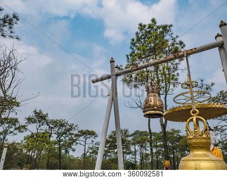 Buddha Statue And Bell On Lanpresrinakarin On Top Of Phu Kradueng Mountain  In Loei City Thailand.ph