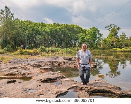 Fat Tourist Jumping On Anodard Pond On Phu Kradueng Mountain National Park In Loei City Thailand.phu
