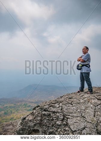 Asian Fat Trekker On Yeabmek Cliff Phu Kradueng Mountain National Park In Loei City Thailand.phu Kra