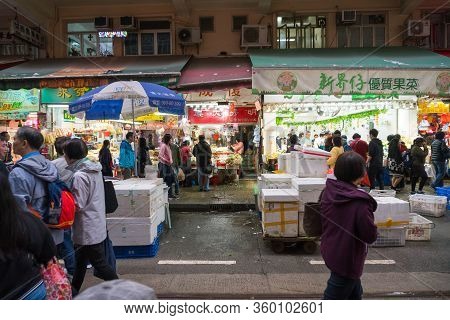 Hong Kong,march 24,2019:people Among The Classic Markets In The Narrow And Crowded Streets Of Hong K