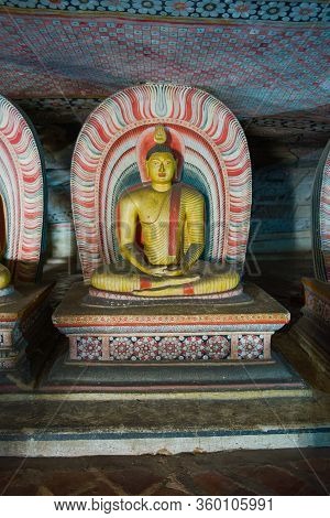 Ancient Sculpture Of A Sitting Buddha In The Cave Buddhist Temple Of Rangiri Dambulu Raja Maha Vihar