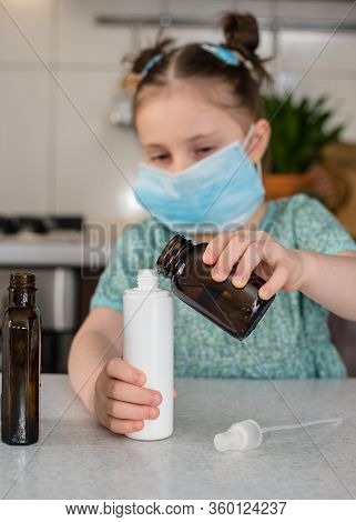 Kid Girl Makes Sanitaizer Or Antiseptic Gel At Home. Hygiene During Coronavirus Epidemic. Concept Of