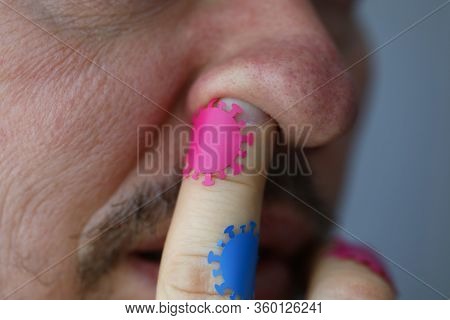 Close-up Of Person Touching Mucous Membranes Of Nose With Dirty Hand. Macro Shot Of Male Skin Covere