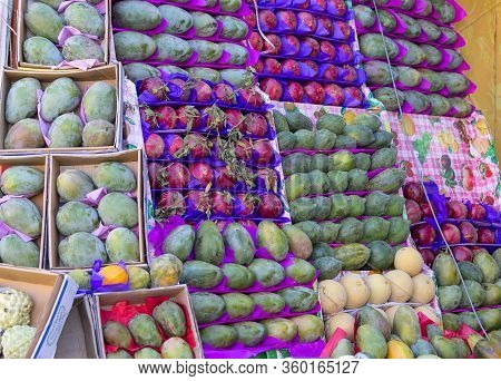 Sharm El Sheikh, Egypt - November 22, 2019: Beautiful Ripe Tropical Fruits : Pomegranate; Mango; Mel