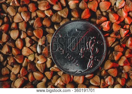 Close-up One Ruble Coin In Raw Buckwheat