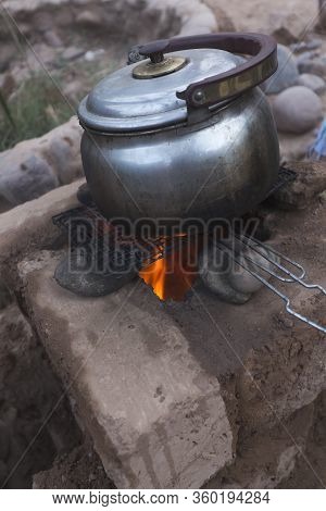 Cooking In A Clay Rocket Kitchen In M'hamid El Ghizlane