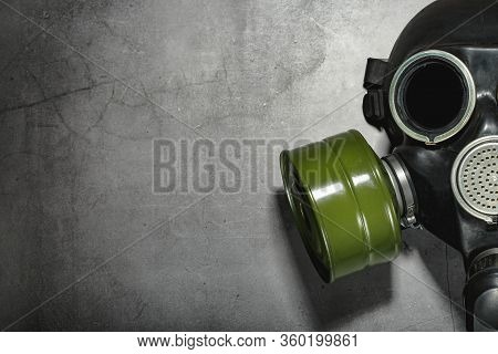 Gas Mask On A Black Stone Background, Protection From Dangerous Infection.