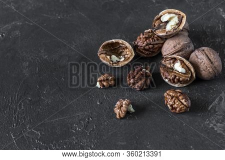 Halves Of The Kernel Of A Healthy Walnut Without Shell On A Dark Background, Walnut Macro Food Photo