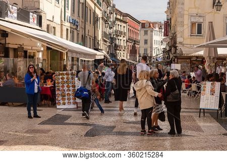 Lisbon, Portugal - 8 March 2020: Pedestrians & Tourists On Rua Das Portas De Santo Antao