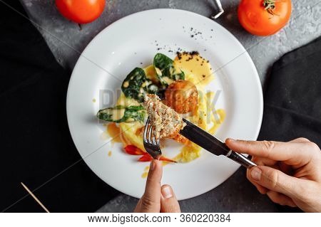 Cheese Balls In The Sauce. With Fork, Knife In Hand